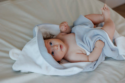 Muslin and bamboo towel with a hood