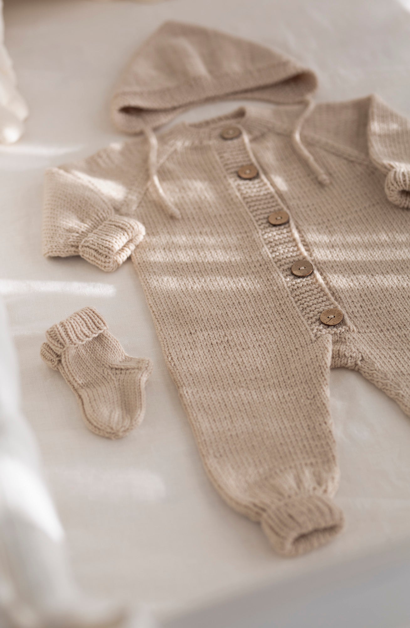 Pirmasis 100% merino vilnos megztas kombinezonas kūdikiams "Mažylis"