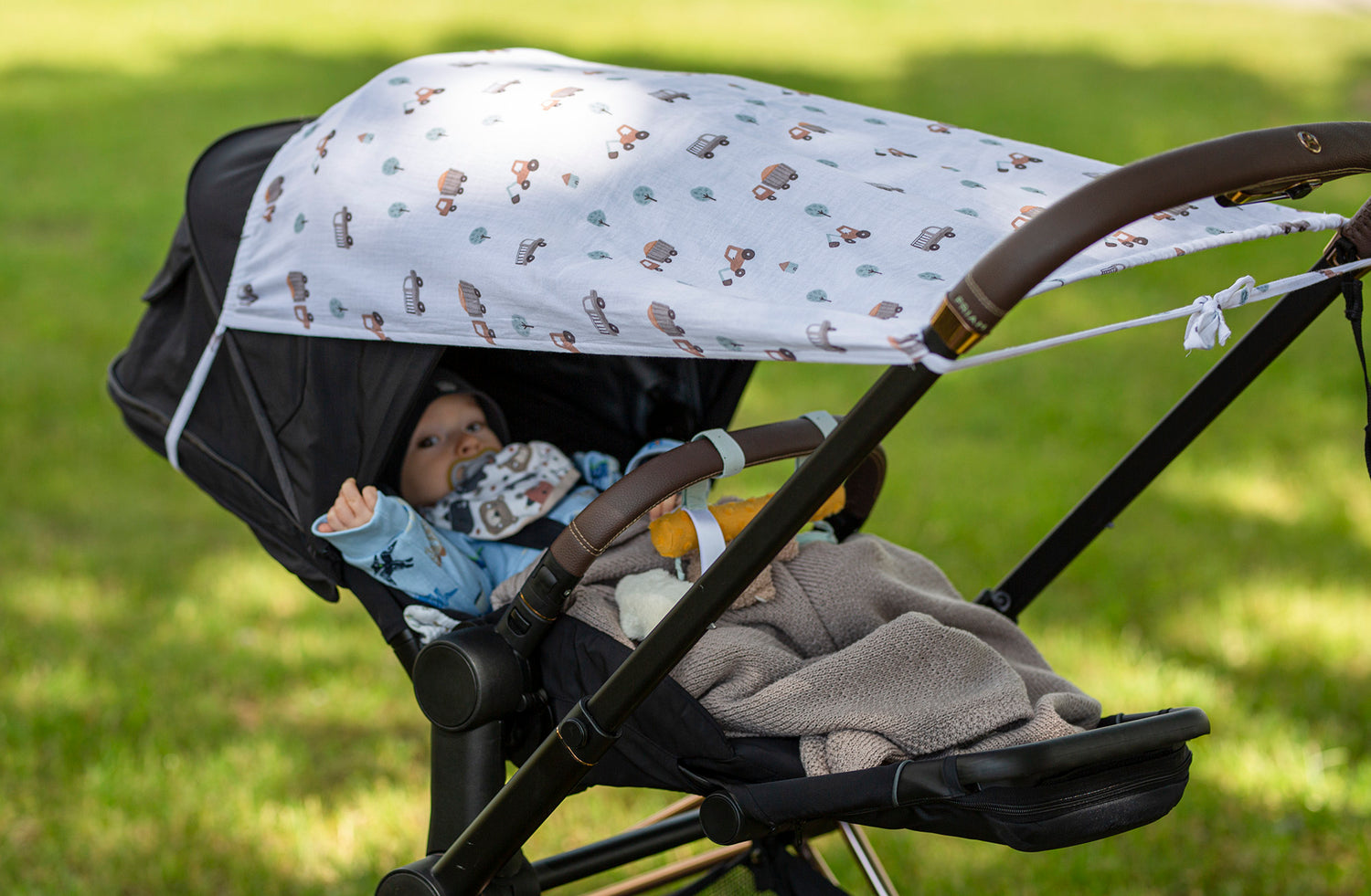Vežimėlio apsauga nuo saulės su užrišama juostele iš muslino