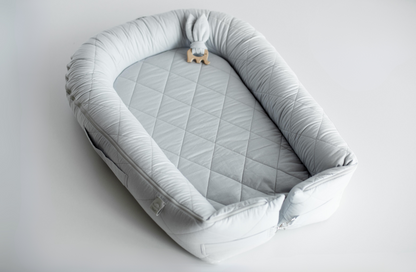 Baby nest with a solid base "Light gray"